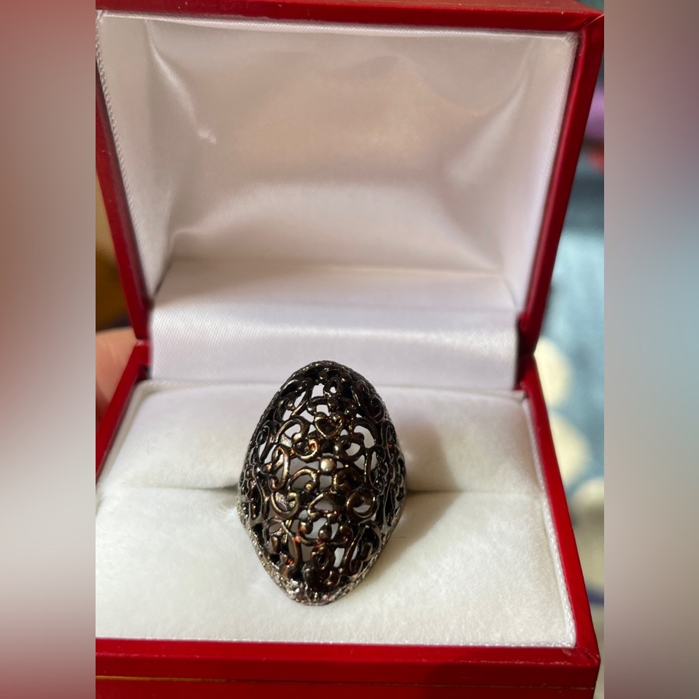 Copper Ring with intricate, filigree-style design.